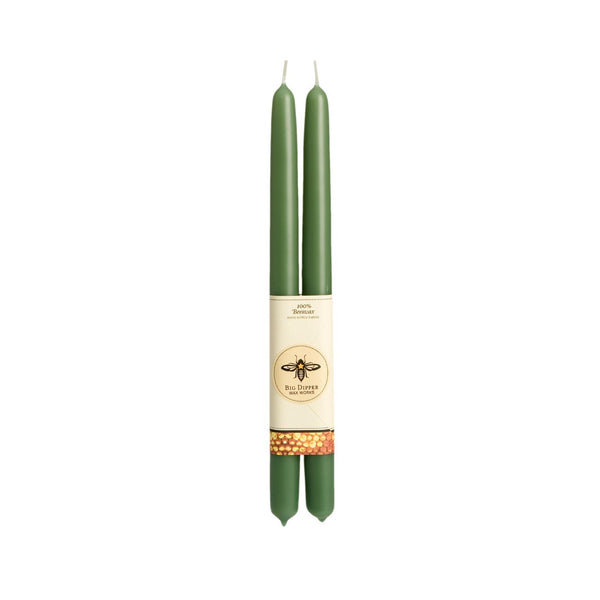 Two green candles with a label in the center on a white background beeswax taper candles big dipper wax works Pittsburgh Lawrenceville