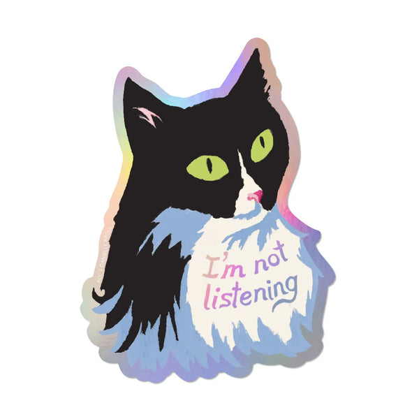 Holographic sticker of a cat with 'I'm not listening' text on a white background vinyl green eyed black cat