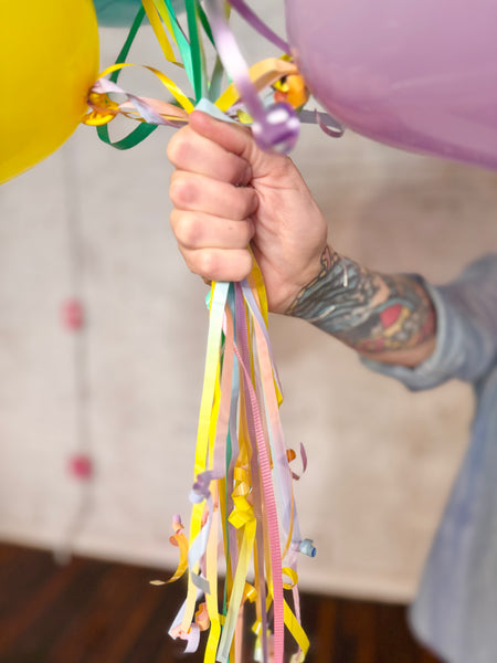 Rainbow balloon tails streamers and strings