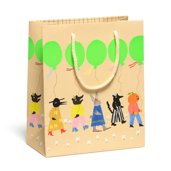 Beige gift bag with colorful illustrations of creatures holding green balloons on a white background neon cute animals birthday parade march white flowers 