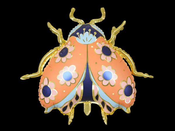 A helium-filled orange. blue, and pink ladybug balloon with gold accents.
